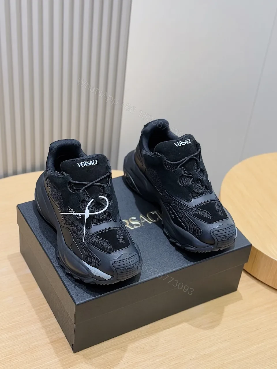 Bold Versace-Style Black Knit Sneaker with Luxe Detailing — view 1