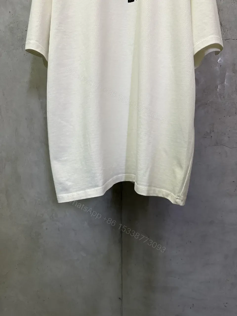 View 5 of Minimalist White Tee with Subtle LV.M. Marking — Premium Everyday Wear