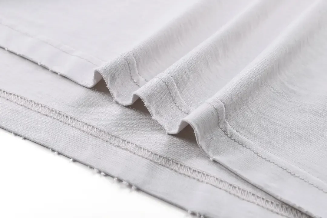 View 7 of Minimal White Cotton Tee: Subtle Logo, All-Day Comfort