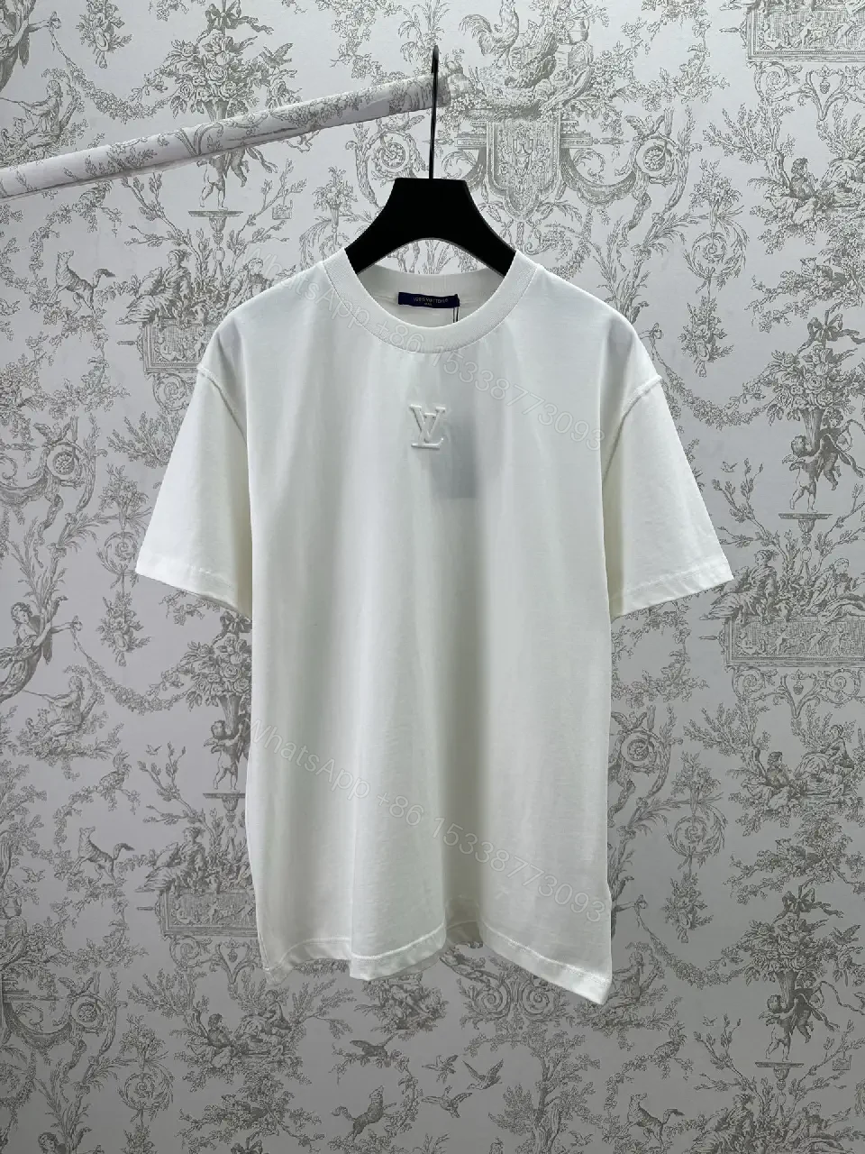 View 10 of Minimalist White Cotton Tee with Embossed Accent, Everyday Luxury
