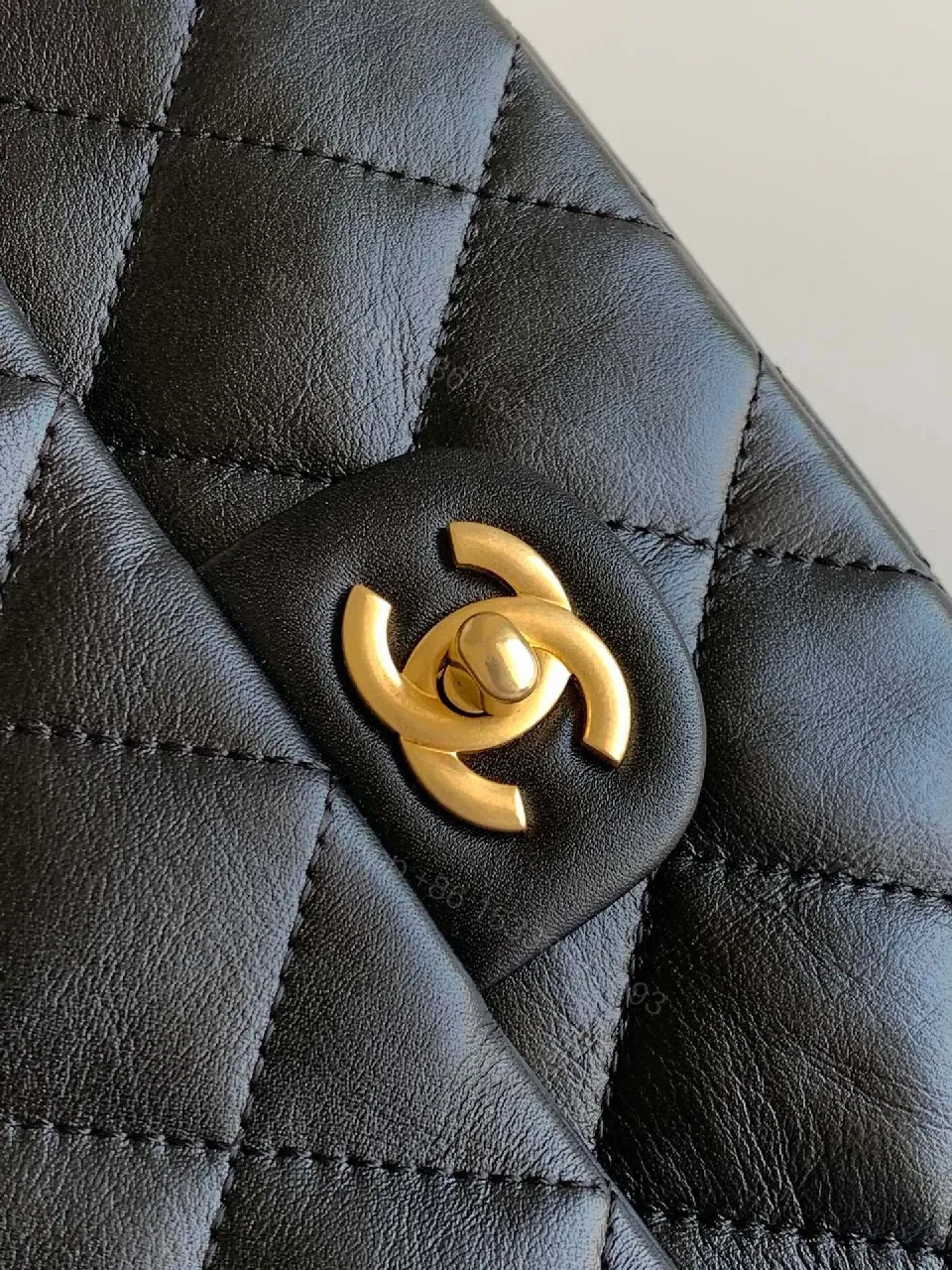 View 9 of Compact Dark Leather Quilted Flap Bag with Gold Hardware