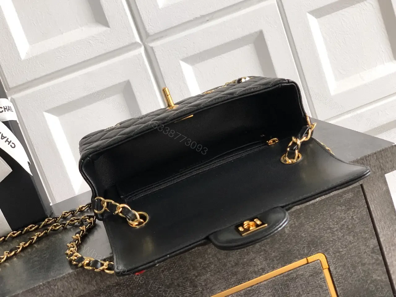 View 5 of Quilted Black Leather Crossbody: Golden Turn-Lock Charm Bag