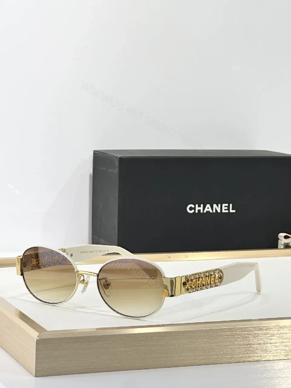 View 3 of Gold-Accented Round Sunglasses: Minimal Luxury Shield