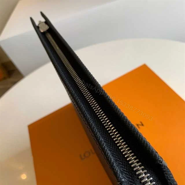 View 9 of LOUIS VUITTON POCHETTE VOYAGE TAIGA LEATHER M30450