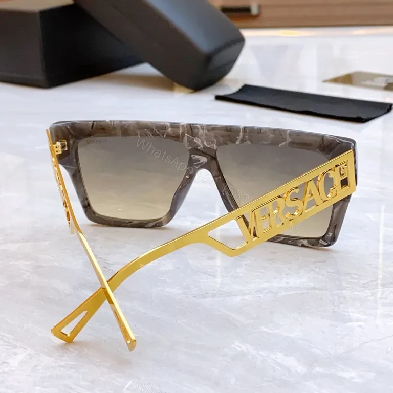 View 3 of Bold Black & Gold Luxe Sunglasses - Statement Frame, All-Day Comfort