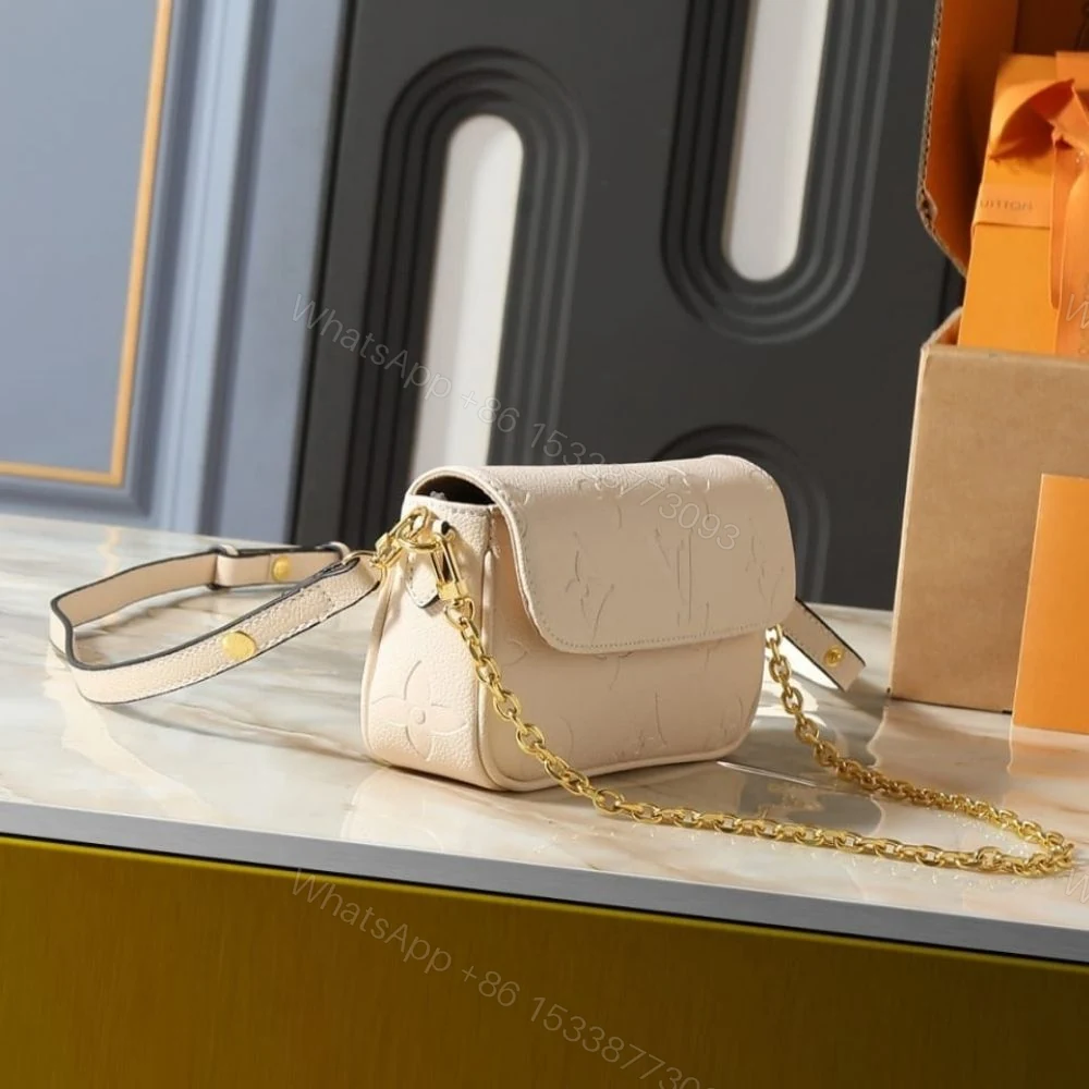 View 3 of Louis Vuitton Wallet On Chain Ivy Monogram Empreinte Cream 23Cm M82210