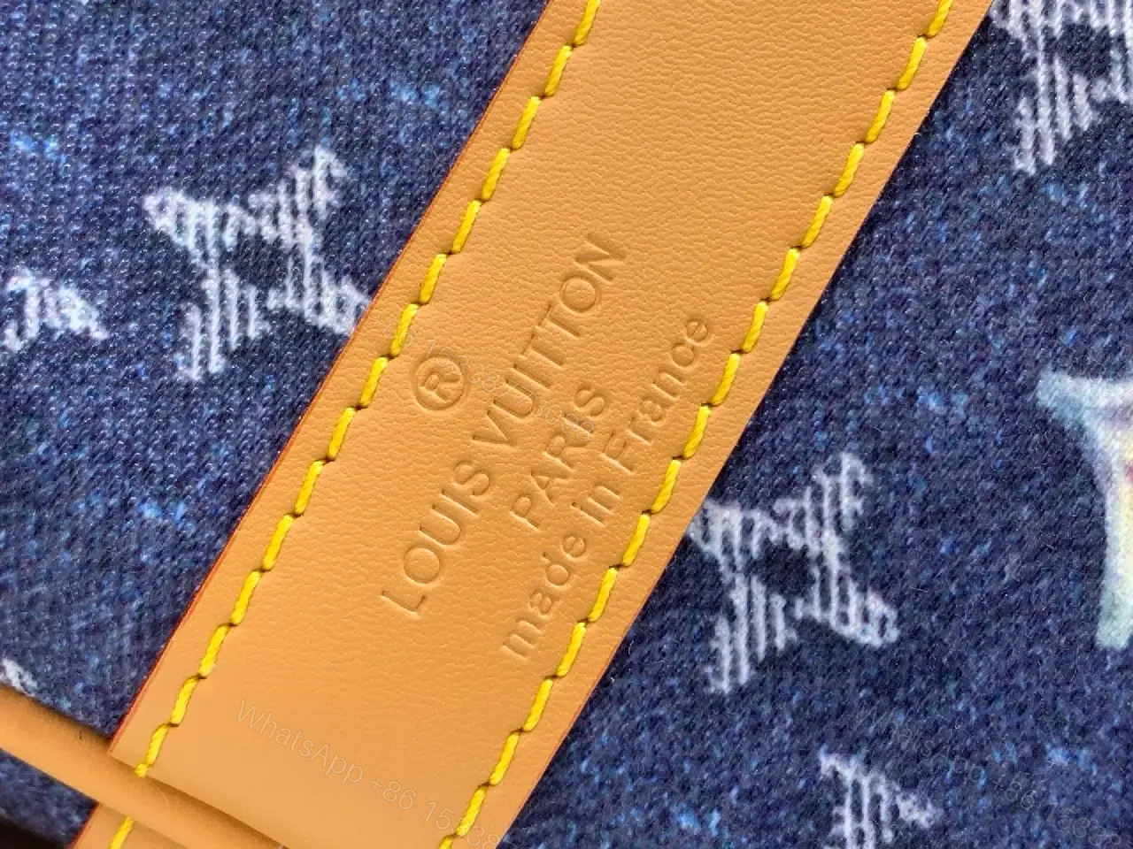View 5 of Blue denim monogram-print travel bag with tan leather trim for luxury weekends
