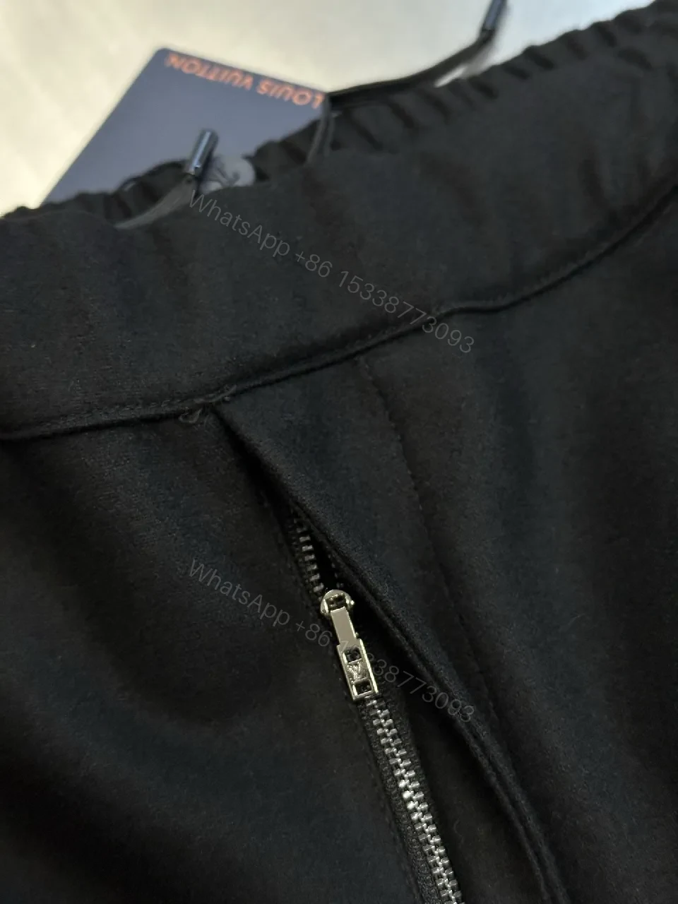 View 9 of Minimalist Tailored Trousers: Subtle LV Monogram Detail