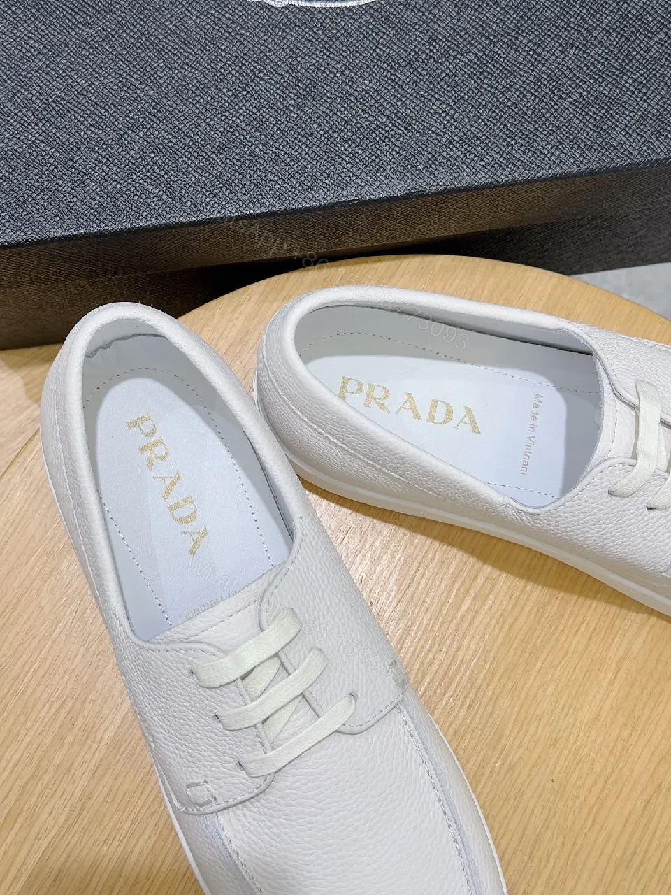View 2 of Minimalist White Leather Low-Top Sneakers with Subtle Luxury Details