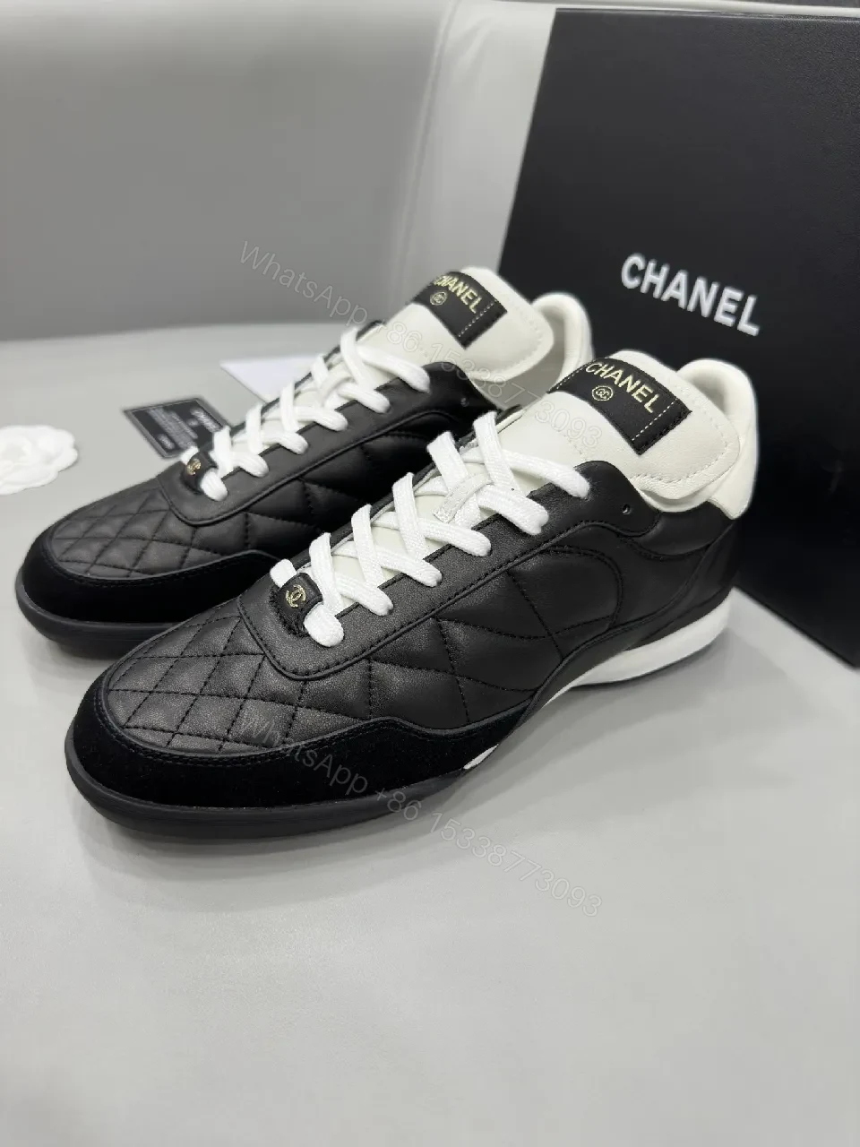 View 3 of Black-and-White Quilted Leather Sneakers with Luxe Hardware