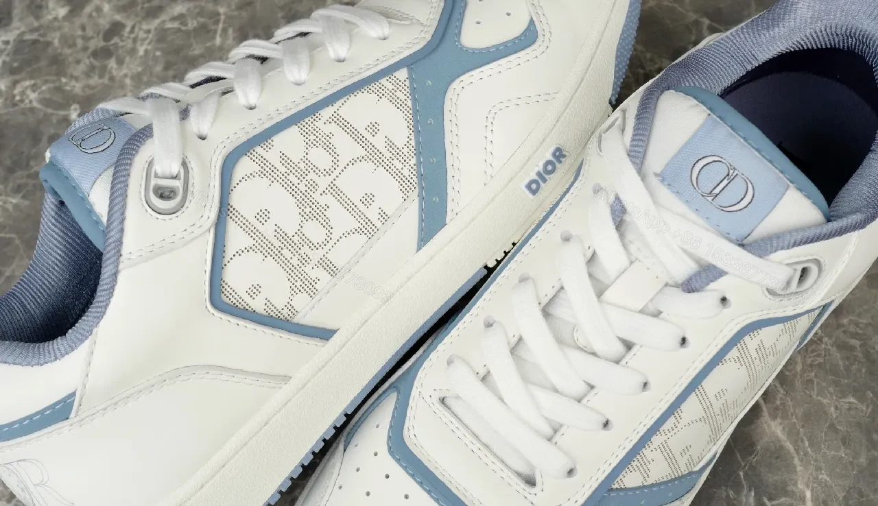 View 8 of Soft-White Leather Sneaker with Blue Accents and Signature Texture