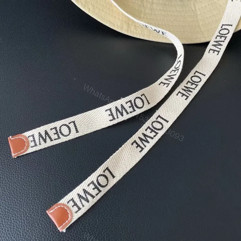 View 8 of Beige Cotton Bucket Hat with LOEWE Patch - Luxury Streetwear