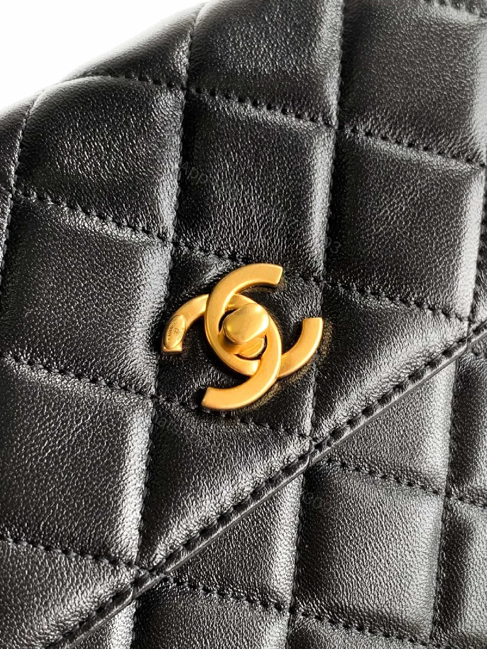 View 2 of Compact Quilted Black Camera Bag with Gold Hardware