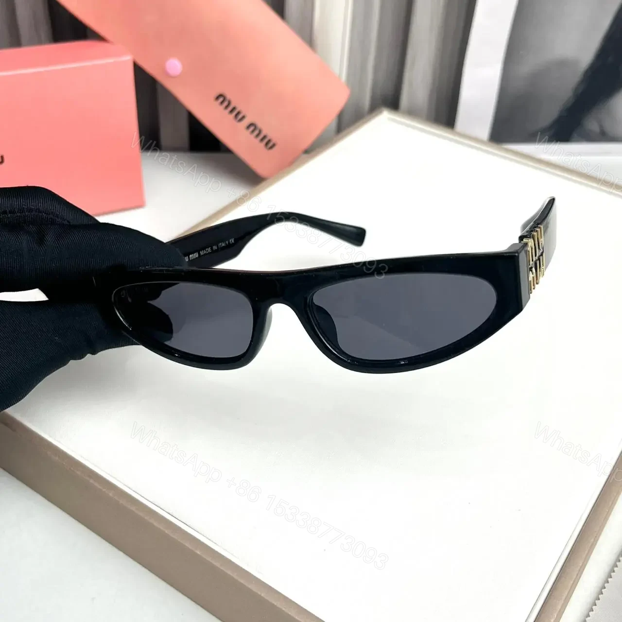 View 2 of Miu Miu Cat Eye Black Sunglasses Women UV Protection