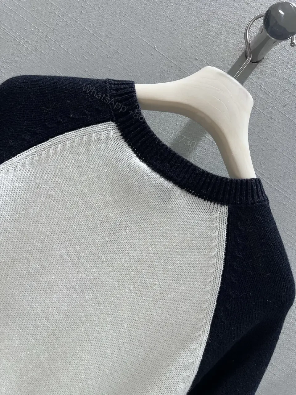 View 2 of Two-Tone Knit Tee with Signature Logo Emblem - Modern Luxury Casual