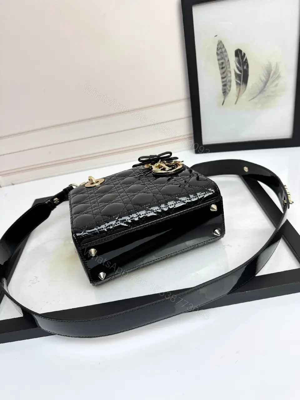 View 8 of Quilted Patent Mini Bag with Gold-Tone Charms, Black