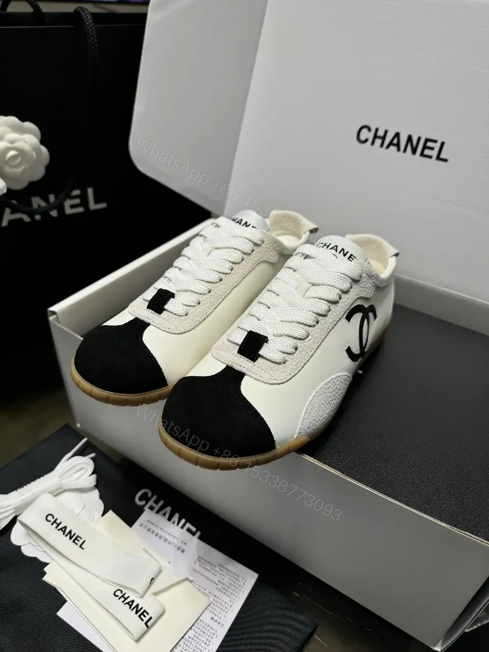 View 3 of Two-Tone White/Black Gum-Soled High-Top Sneakers