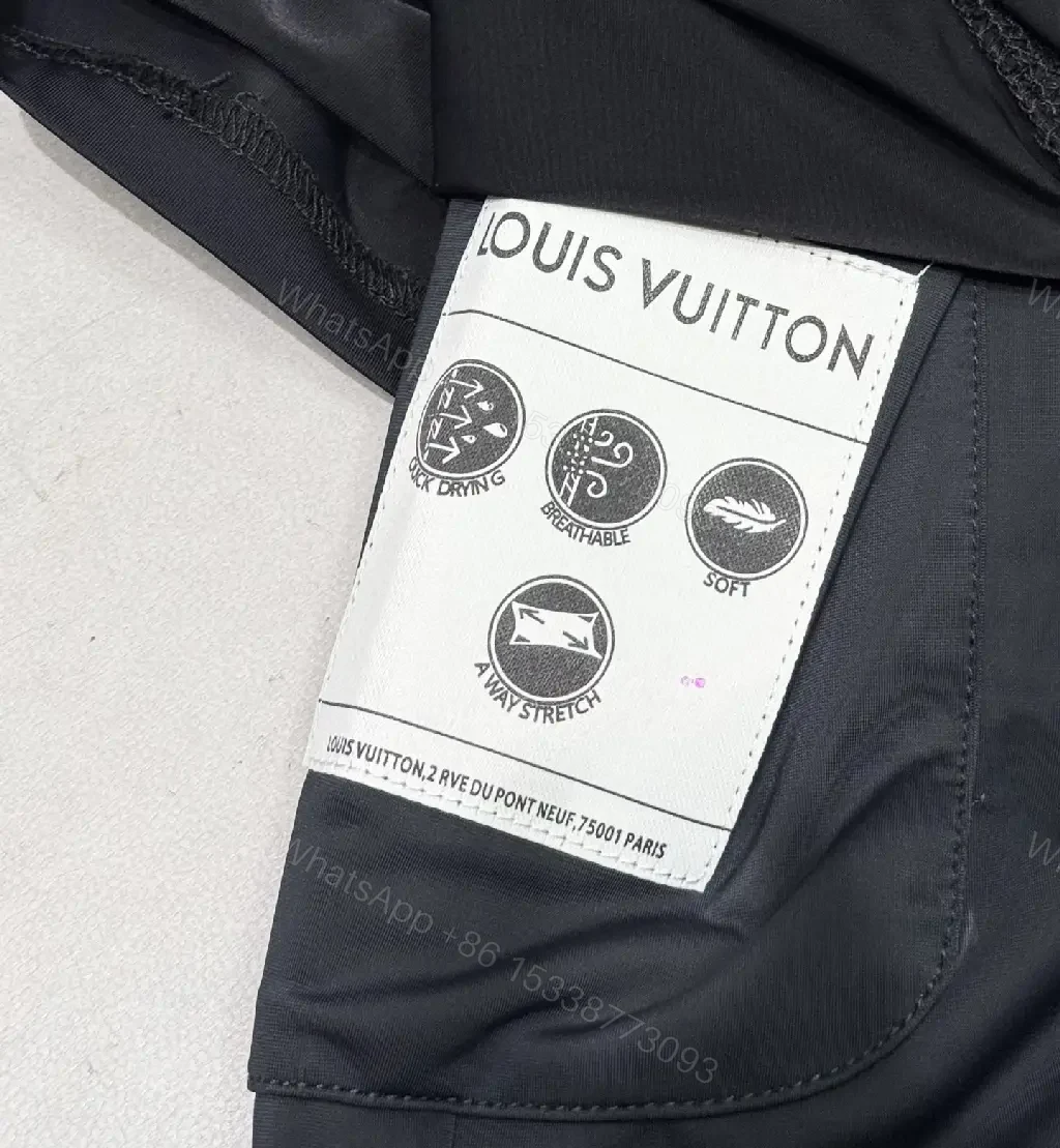View 4 of Matte Black Quick-Dry Shorts with Subtle LV Detailing