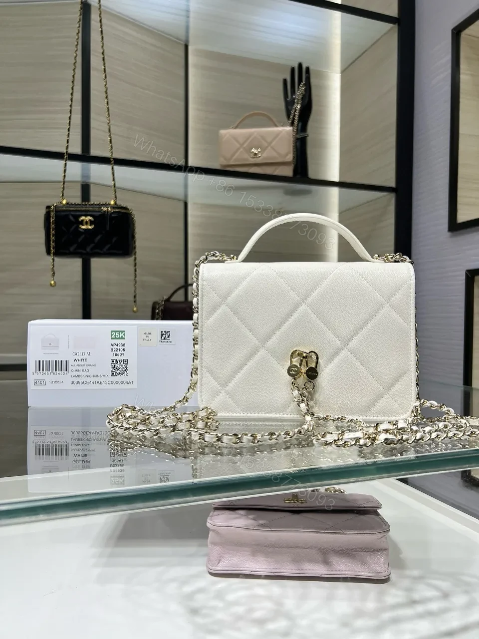 View 3 of White Quilted Mini Bag: Gold Logo, Structured Luxury, Compact