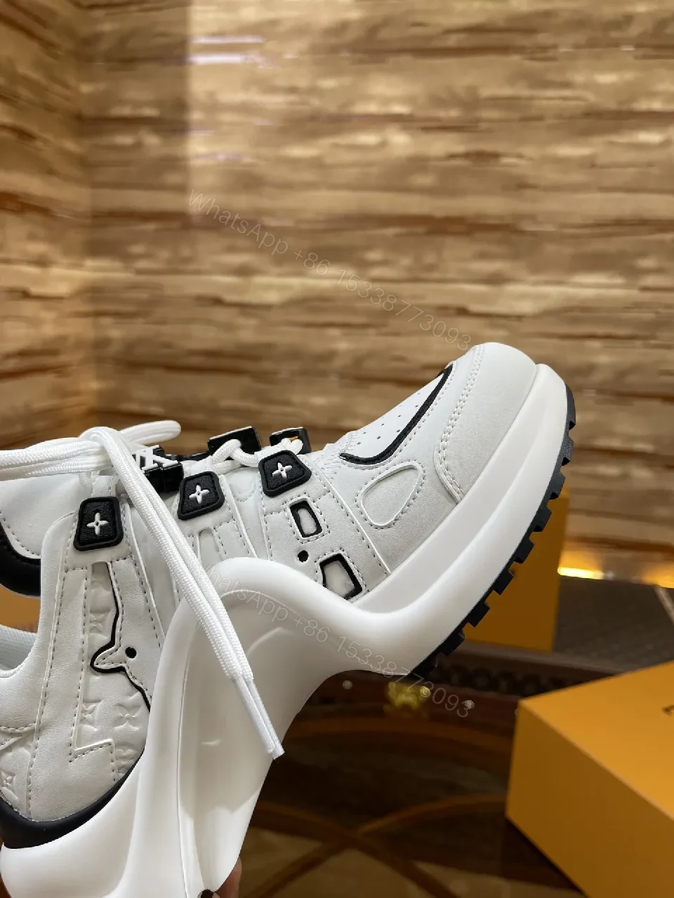 View 2 of Premium Leather High-Top Sneakers with LV Embellishments
