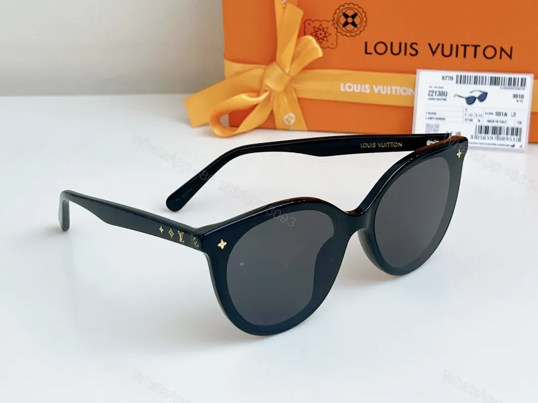 View 3 of Sleek Black Round-Frame Sunglasses with LV Accents