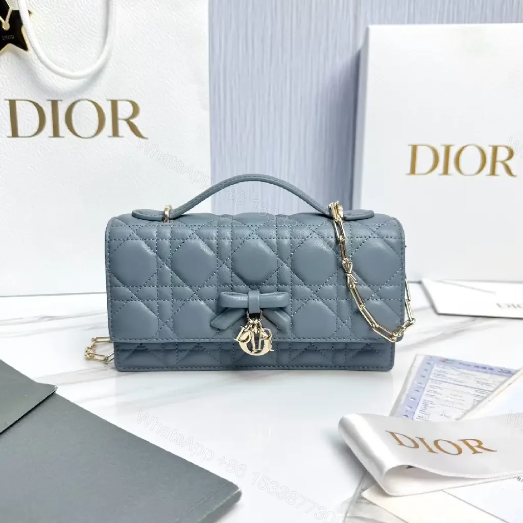 View 9 of Muted Blue-Gray Quilted Crossbody with Bow Charm, Luxe Everyday