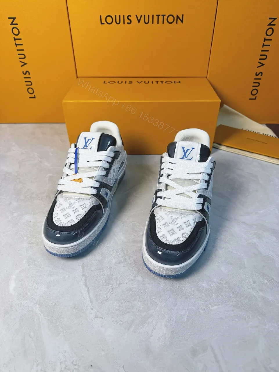 View 9 of Bold Navy Leather Textured Sneakers with LV Accent