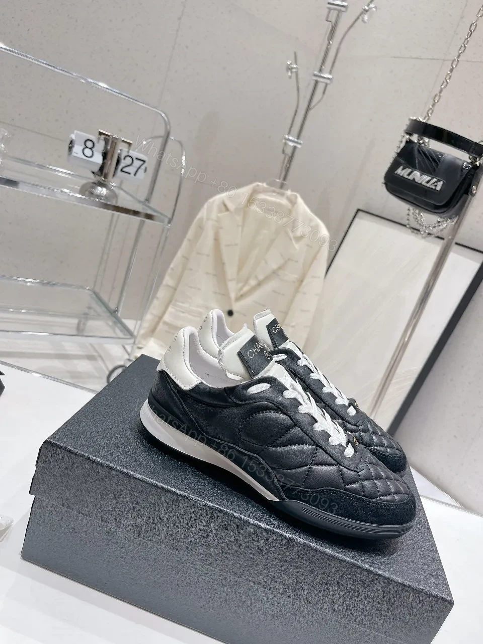View 6 of Quilted Black Leather Sneakers with Luxe Branding Detail