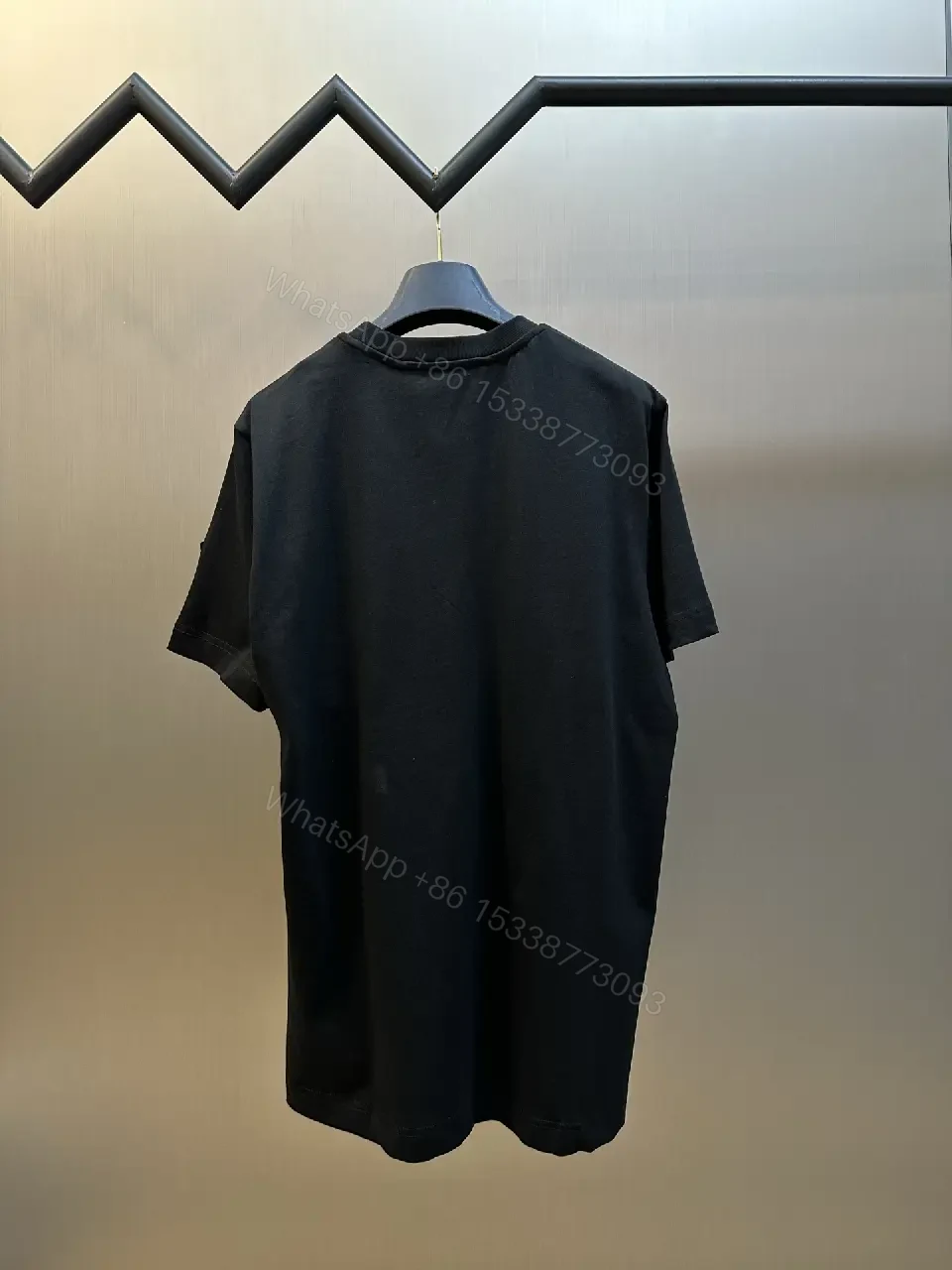 View 9 of Textured Logo Black Tee with Subtle Hardware - Premium Cotton Blend