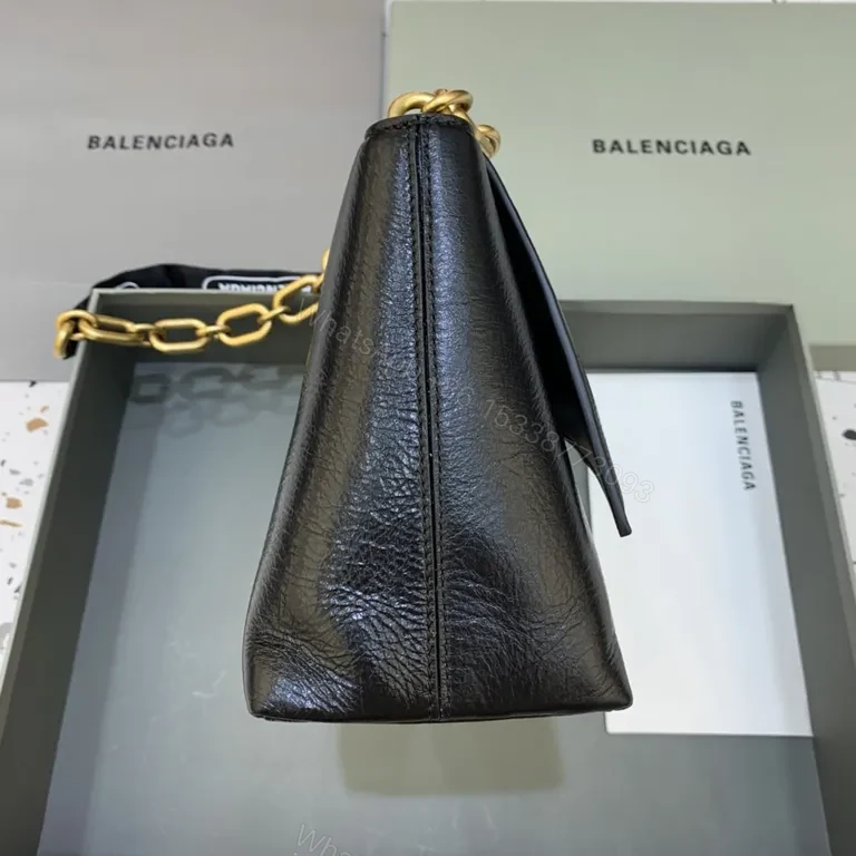View 8 of Chic Black Leather Crossbody with Bold Gold Hardware Bag