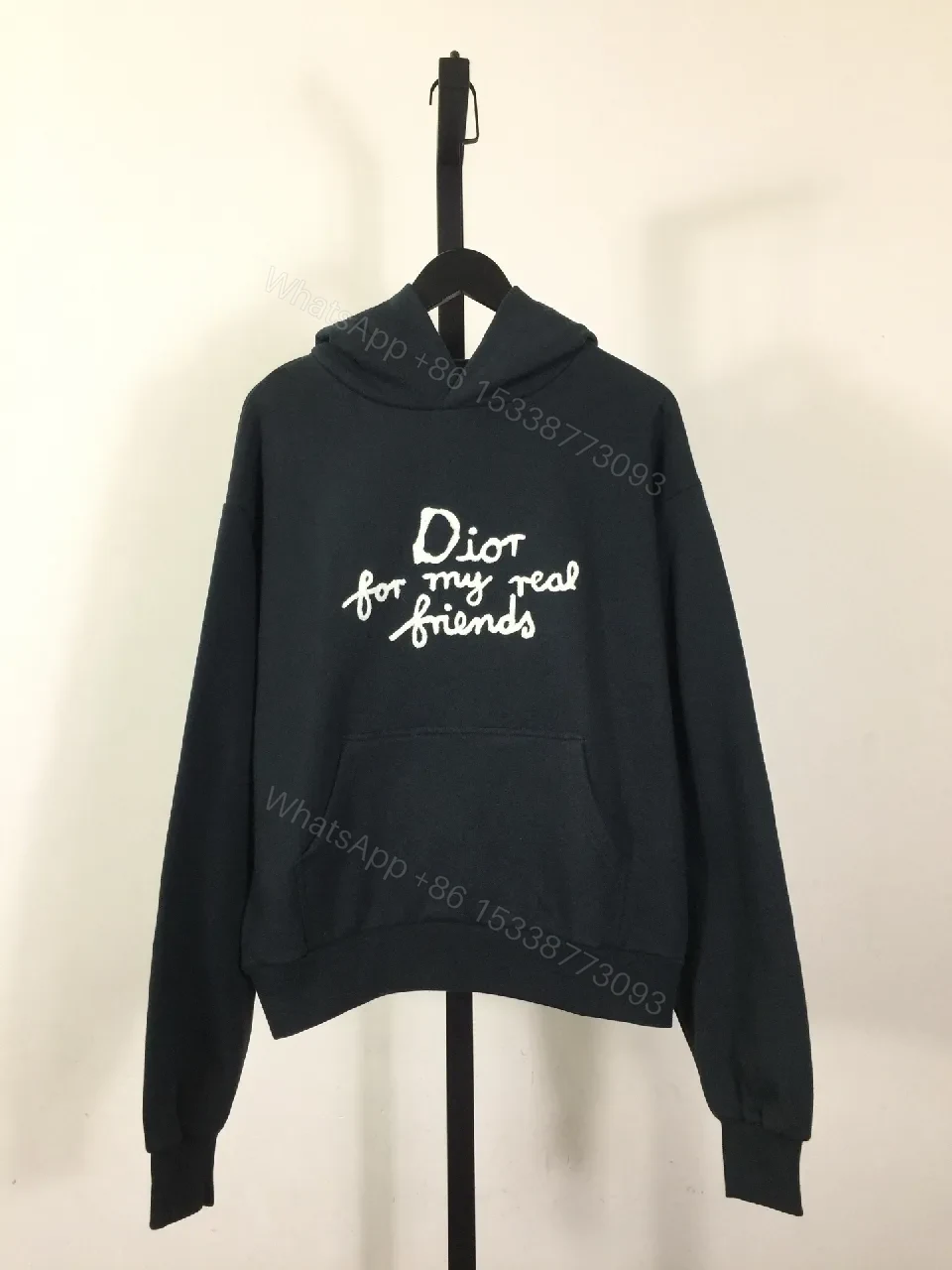 White-on-Black Luxury Hoodie with Scripted Logo — view 1