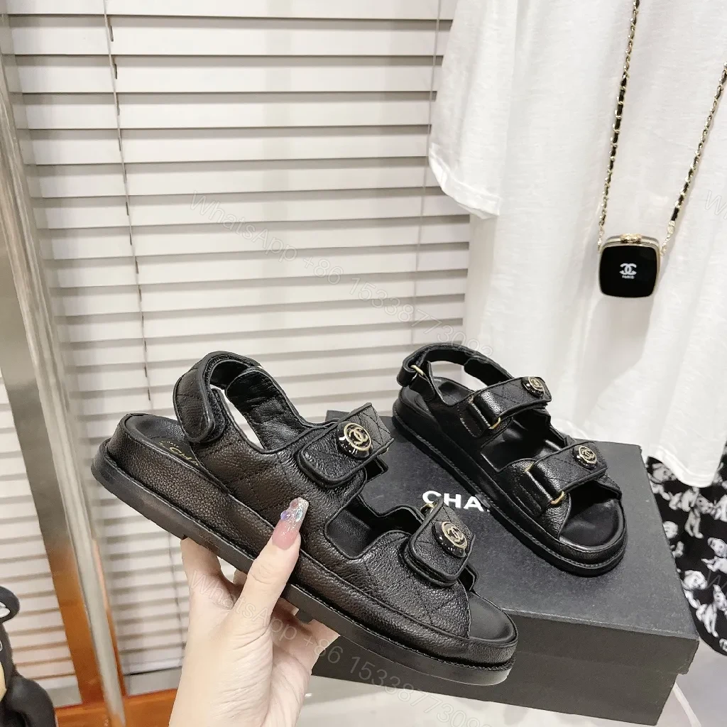 View 7 of Chic Black Leather Sandals with Signature Hardware