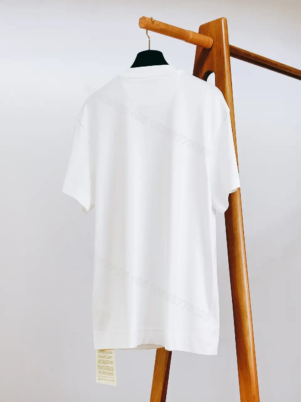 View 8 of Minimalist White Cotton Tee with Subtle Luxury Detail