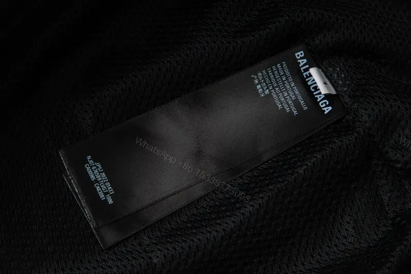 View 4 of Minimalist Black Windbreaker: Subtle Branding, All-Season Outerwear