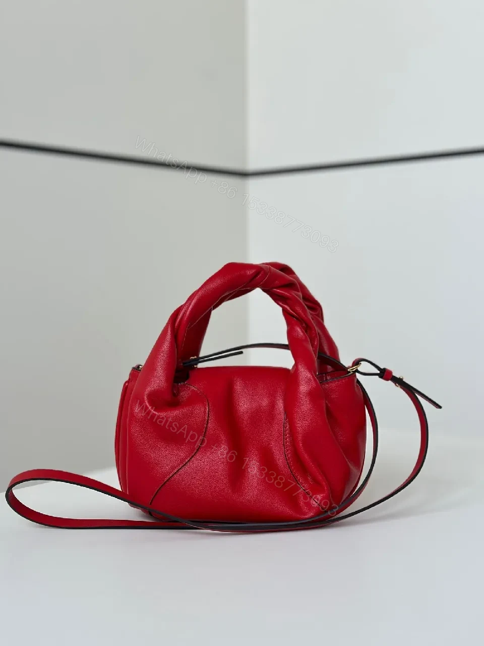 View 5 of Red Leather Knotted Mini Bag, Structured, Crossbody Ready