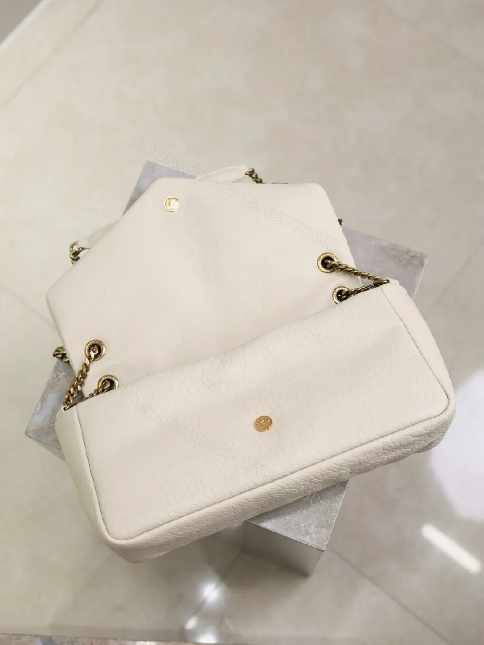 View 7 of Ivory Pebbled Leather Chic Handbag with Gold Hardware