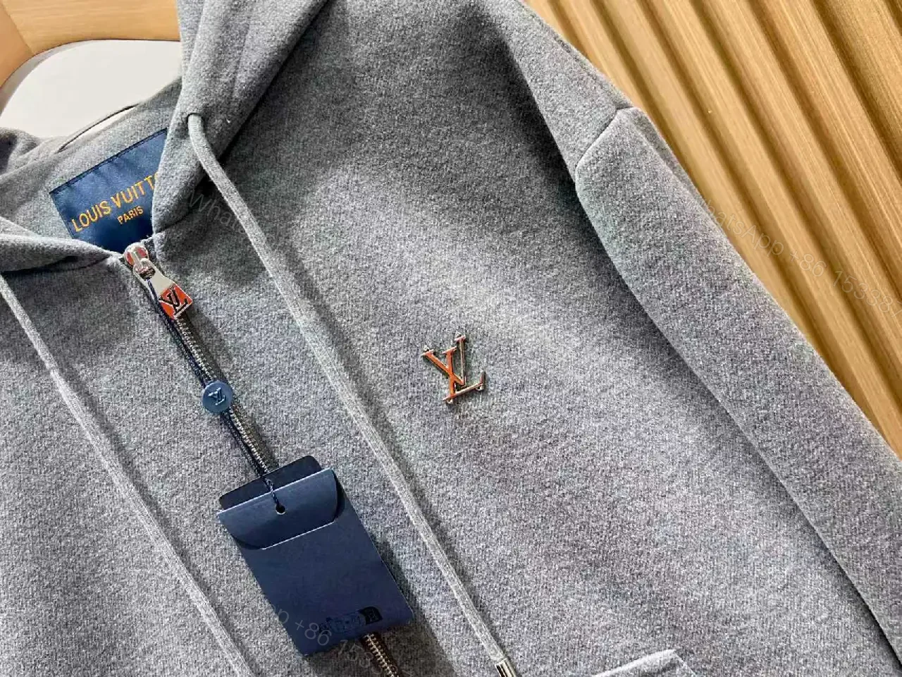 View 10 of Cozy Black Knit Zip Hoodie with Subtle Emblem Embellishment