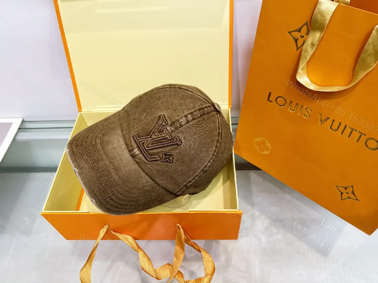 View 4 of Distressed Cotton-Twill Cap: Subtle LV Monogram Luxury