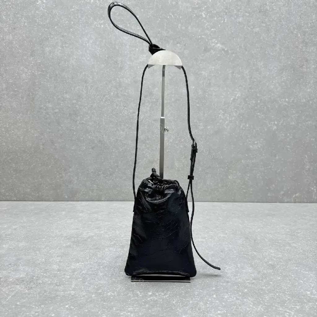 View 2 of Black Leather Drawstring Crossbody Bag - Minimalist Luxe Compact Carry