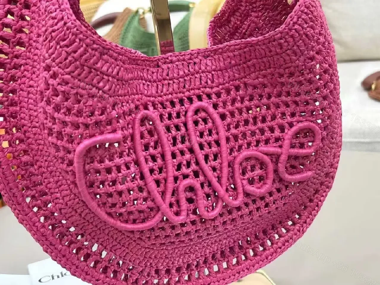 View 2 of Magenta Crochet Crescent Bag: Elegant, Compact, Textured Luxe