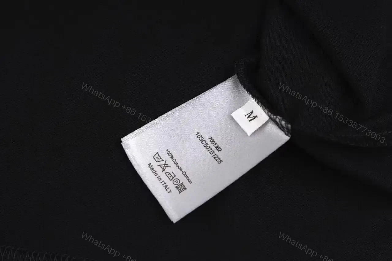 View 3 of Monochrome Black Cotton Twist Tee — Subtle Logo, Luxe Style