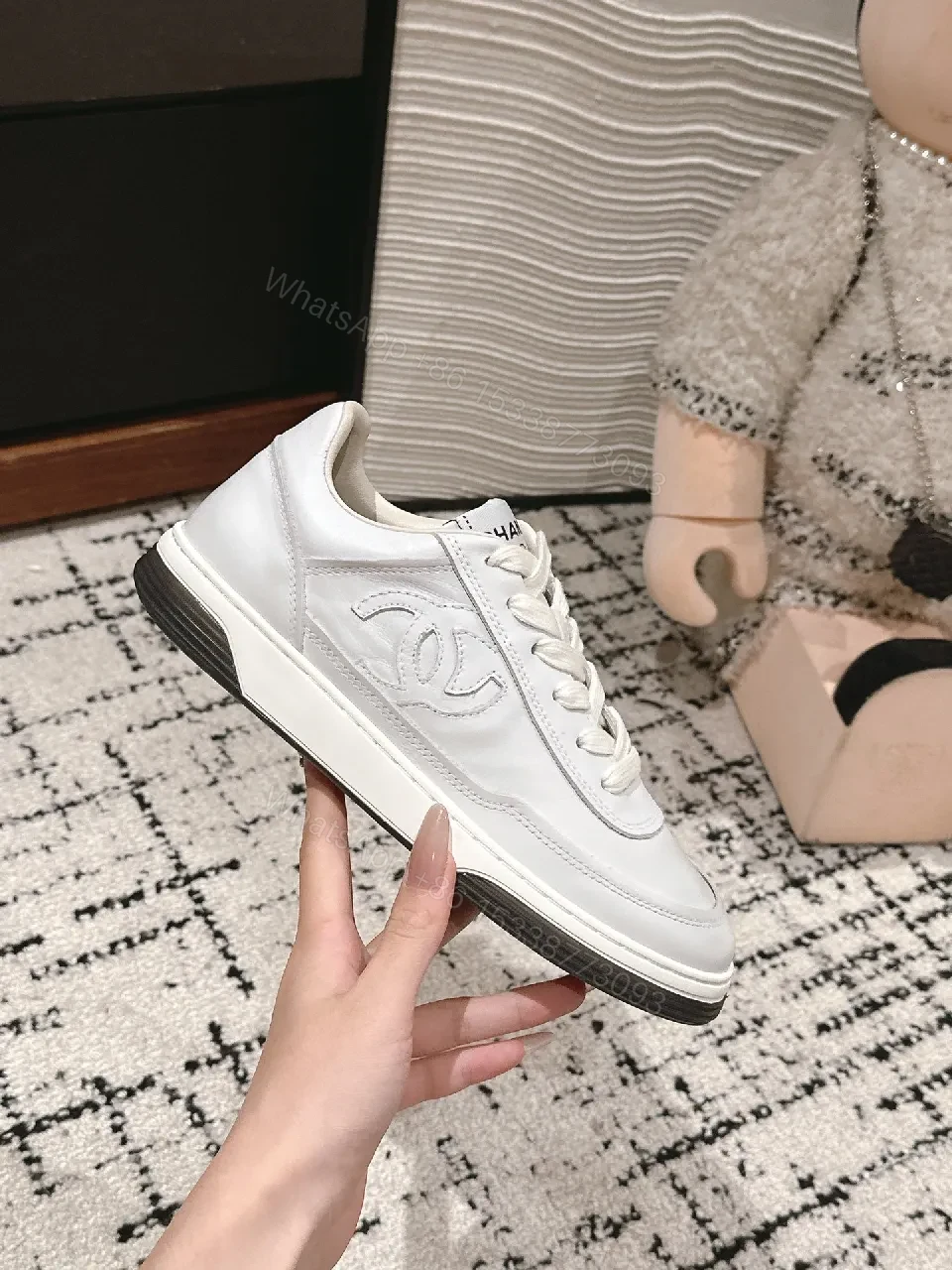 View 9 of Minimalist White Leather Sneakers with Subtle Chanel Detailing