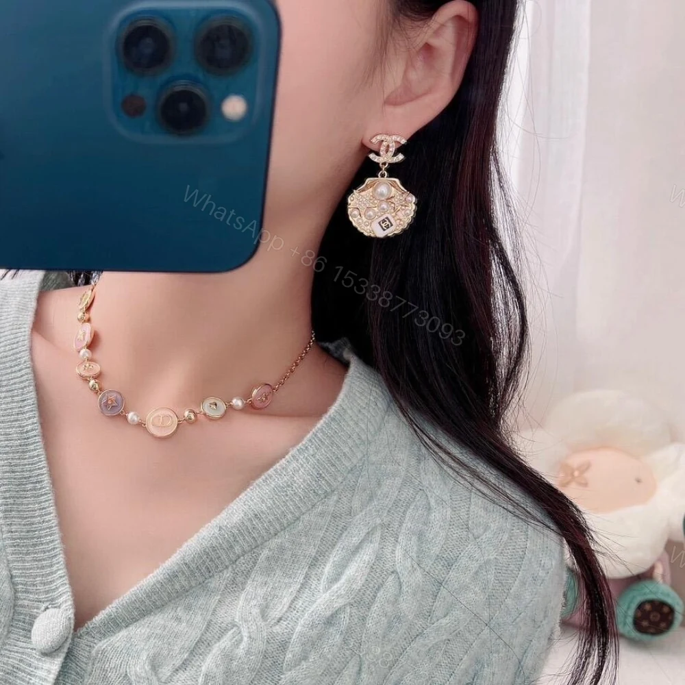 View 5 of CHANEL CLIP ON PENDANT EARRINGS GOLD TONE ABF071 B19292 NADGB