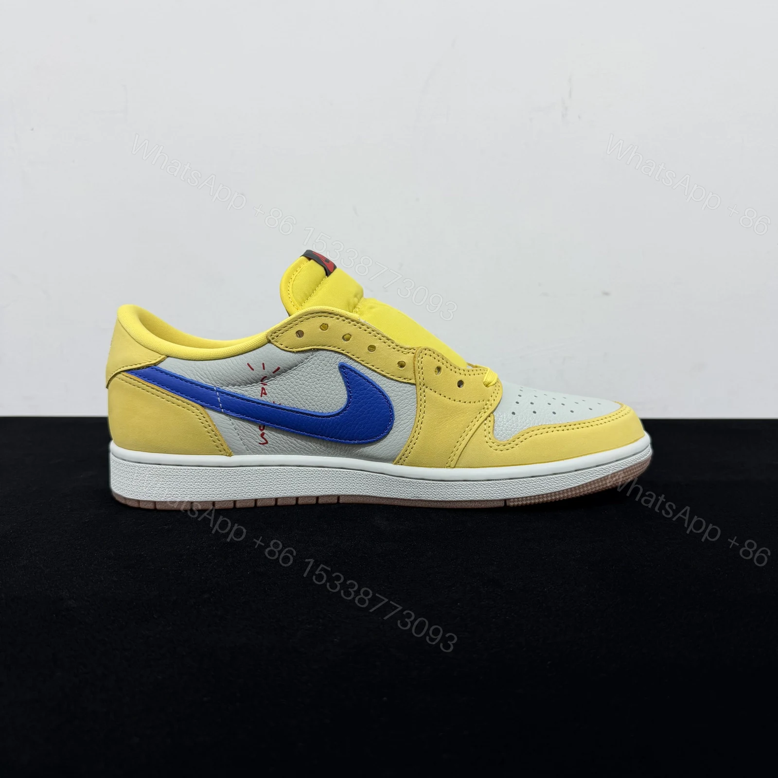 View 2 of Travis Scott x Air Jordan 1 Low OG Canary Reps