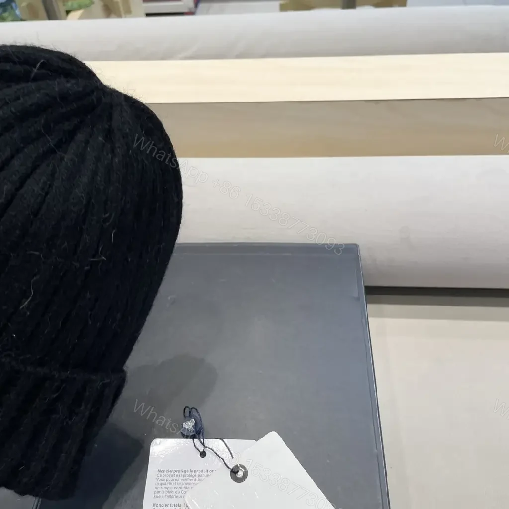 View 5 of Cozy Black Knit Beanie with Signature Patch, Luxury Style