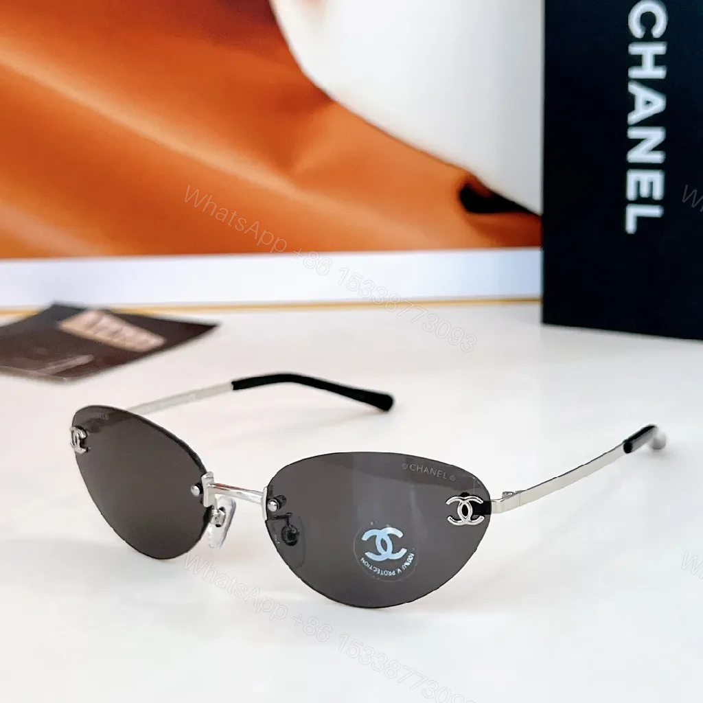 View 9 of Rimless Blue Lens Sunglasses with Gold-Tone Frames