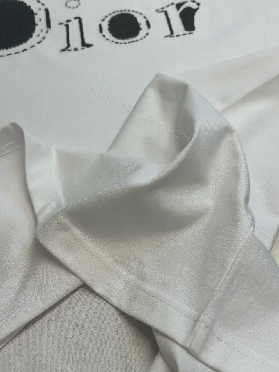 View 2 of Minimalist White Logo Tee - Premium Cotton, Modern Fit, Graphic Accent