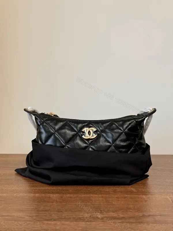 Quilted Crossbody with Gold Emblem: Compact Luxury Bag — view 1