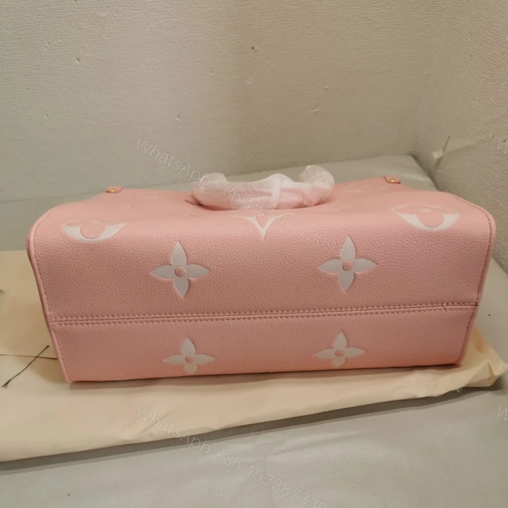 View 6 of Louis Vuitton Onthego MM Monogram Empreinte Leather Trianon Pink 33Cm M46286