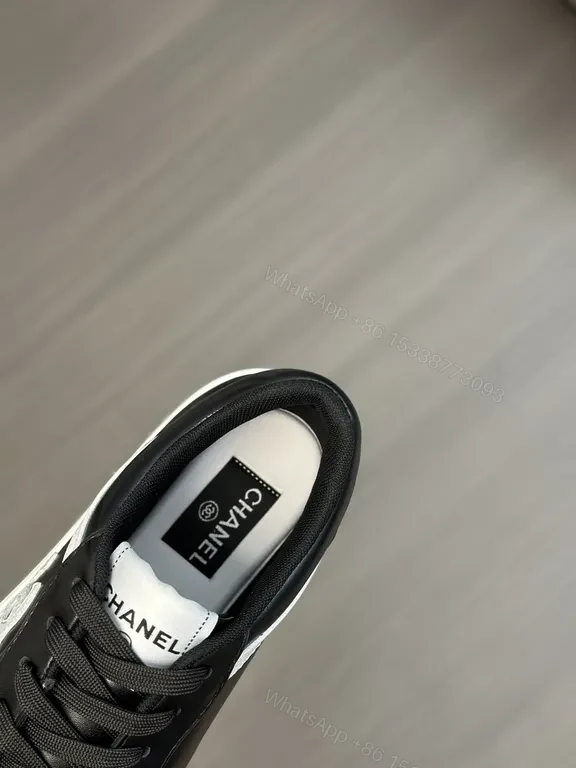View 9 of Monochrome Chanel-Style Low-Top Sneakers with Signature Emblem